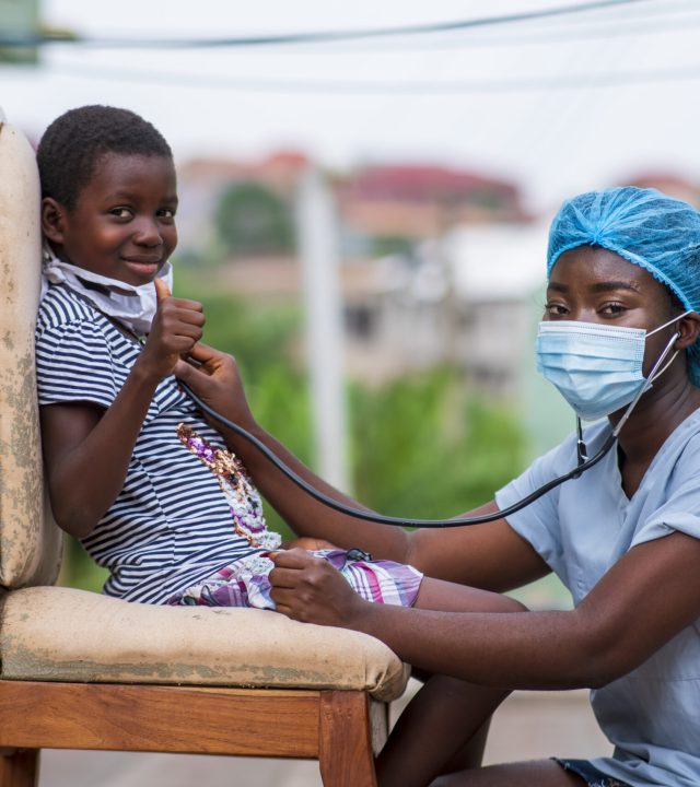 A closeup shot of a boy getting a checkup by a doctor